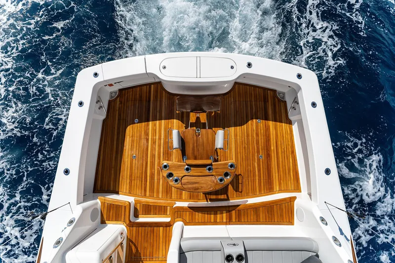 Slide: The Image of Aerial view of 2026 Viking 50 Convertible yacht deck on open sea. - 21