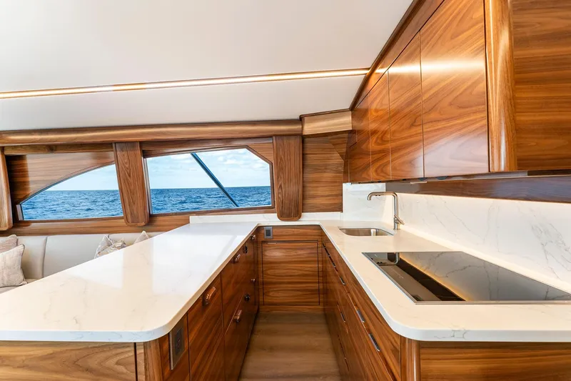 Slide: The Image of Luxurious kitchen interior of 2026 Viking 50 Convertible yacht with ocean view. - 11