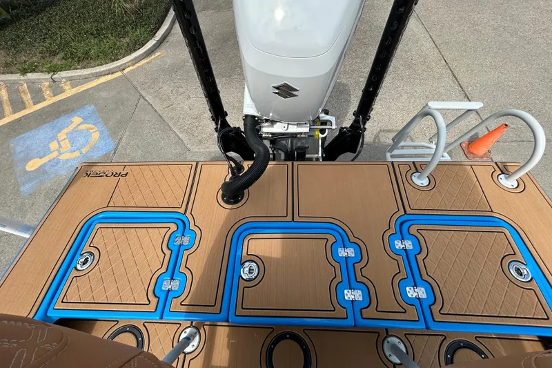 Slide: The Image of Top view of 2026 Skuta 24 Skuta Cat boat deck with Suzuki engine. - 9