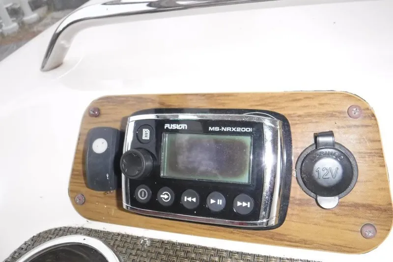 Slide: The Image of Control panel of a 2014 Grady-White Freedom 335 boat with Fusion MS-NRX200i system. - 10
