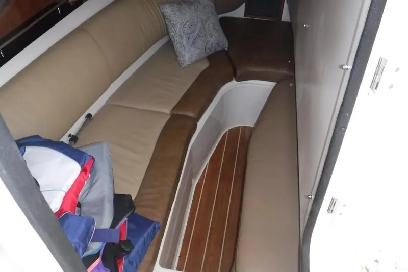 Slide: The Image of Interior cabin of 2014 Grady-White Freedom 335 boat with cushioned seating and wooden flooring. - 17