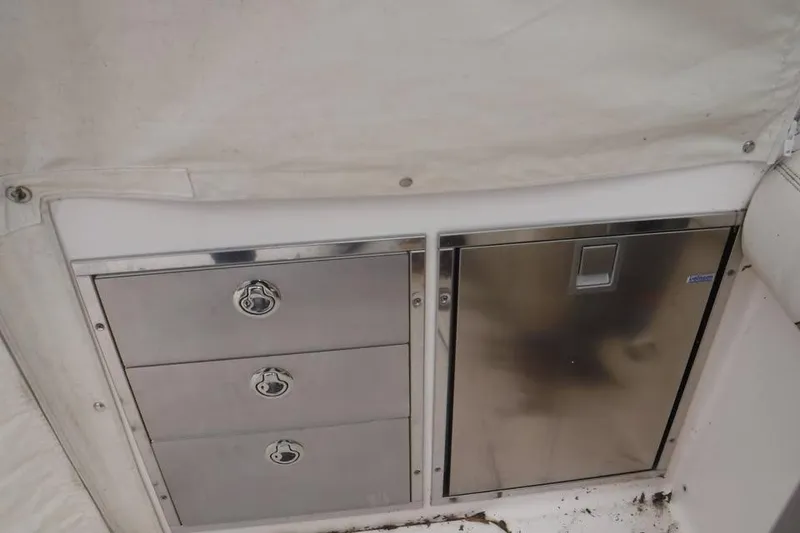 Slide: The Image of Stainless steel storage and fridge on 2014 Grady-White Freedom 335 boat. - 19