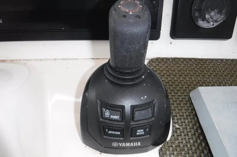 Slide: The Image of Yamaha joystick control on 2014 Grady-White Freedom 335 boat dashboard. - 2