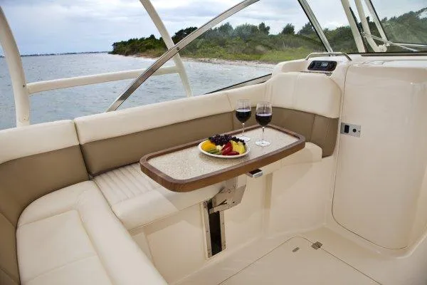 Slide: The Image of Manufacturer Provided Image: Luxurious seating area on 2014 Grady-White Freedom 335 boat with wine and fruit. - 5