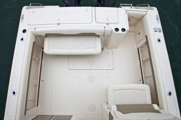 Slide: The Image of Manufacturer Provided Image: 2014 Grady-White Freedom 335 boat interior with seating and storage compartments. - 6