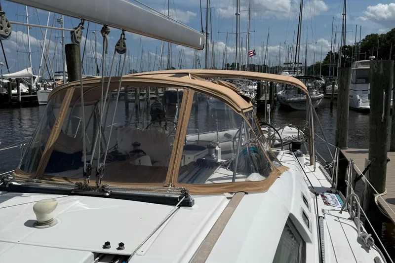 Slide: The Image of Sailboat Beneteau 49, 2007 model, docked at marina with clear skies. - 2