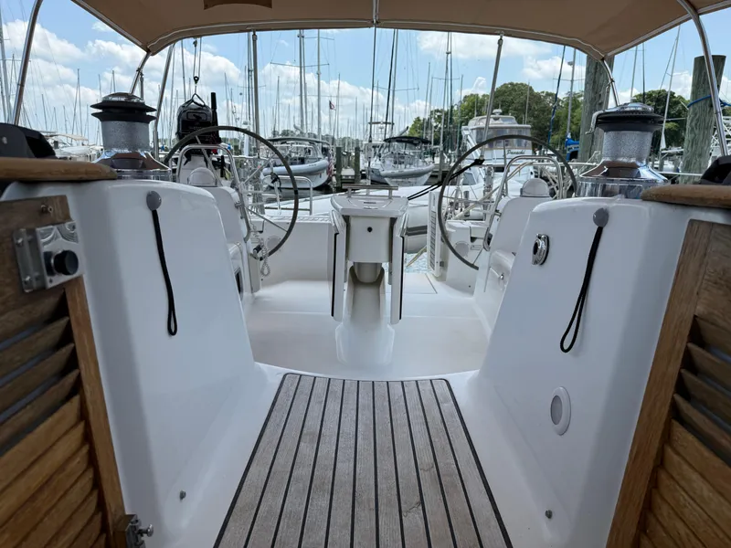 Slide: The Image of Cockpit view of a 2007 Beneteau 49 sailboat docked at a marina. - 24