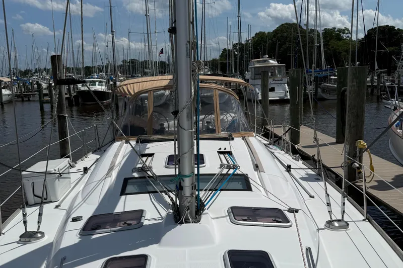 Slide: The Image of Sailboat Beneteau 49, 2007 model, docked at marina with clear sky background. - 34