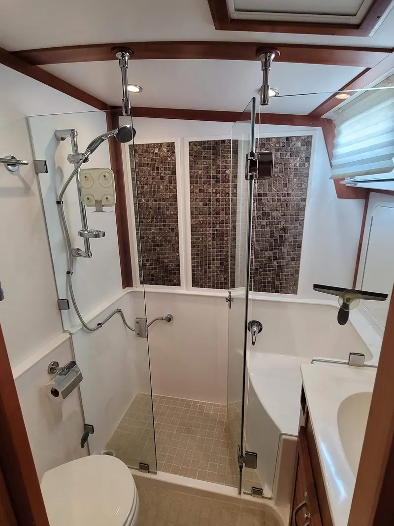 Slide: The Image of Luxurious bathroom in 2014 Sabre 48 Salon Express yacht with modern shower and elegant fixtures. - 12