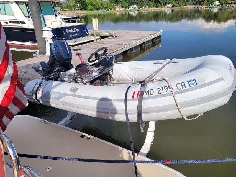Slide: The Image of Inflatable dinghy docked beside a 2014 Sabre 48 Salon Express yacht. - 16
