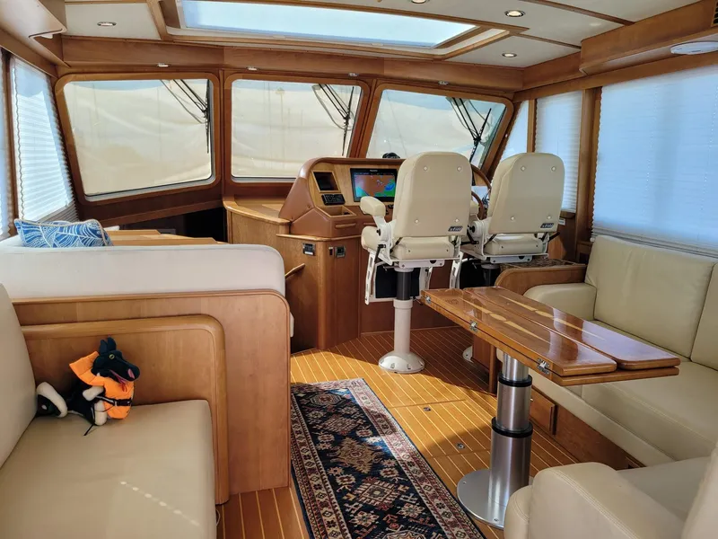 Slide: The Image of Luxurious interior of 2014 Sabre 48 Salon Express yacht with plush seating and helm. - 5