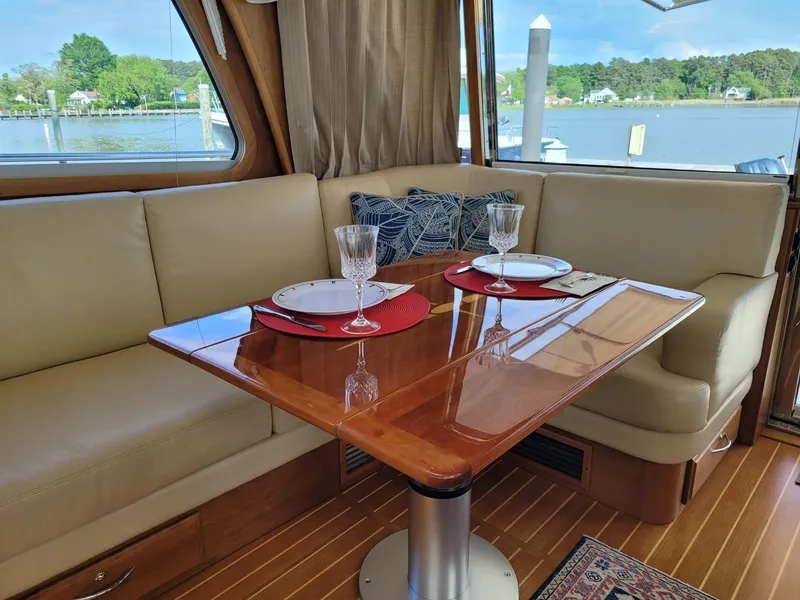 Slide: The Image of Interior of 2014 Sabre 48 Salon Express yacht with elegant dining setup. - 8
