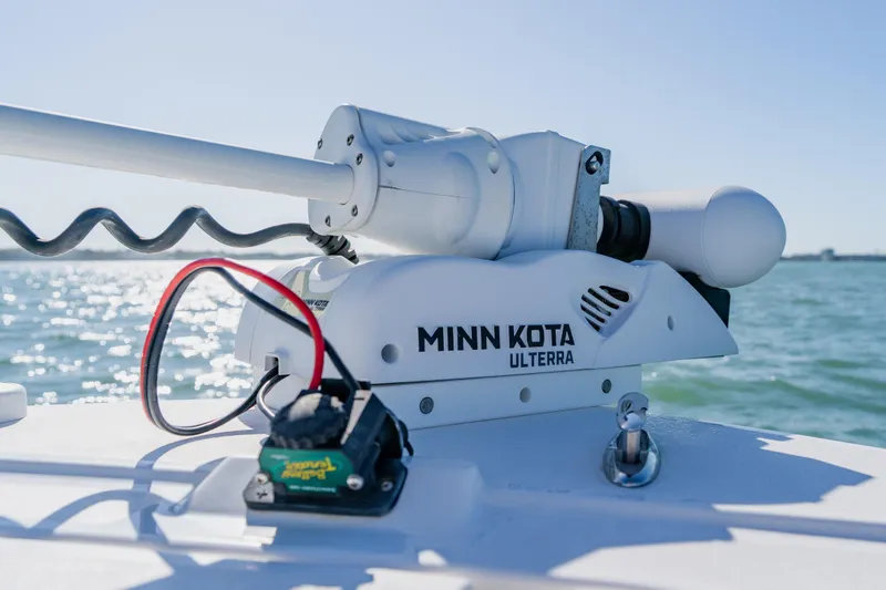 Slide: The Image of Minn Kota Ulterra motor on 2022 Caymas 28 HB boat, ocean background. - 13