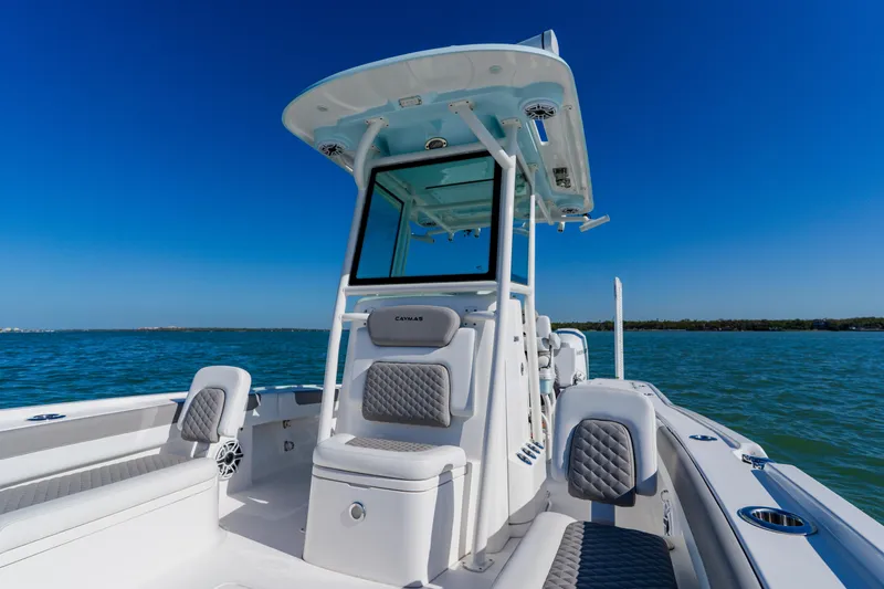 Slide: The Image of 2022 Caymas 28 HB boat on water, featuring sleek design and comfortable seating. - 16