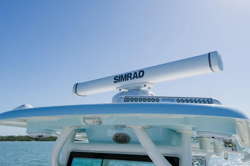 Slide: The Image of 2022 Caymas 28 HB boat with Simrad radar and Razor light bar on the roof. - 18