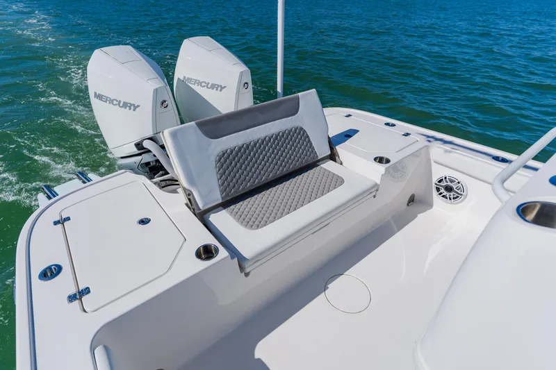 Slide: The Image of 2022 Caymas 28 HB boat with dual Mercury engines on open water. - 33