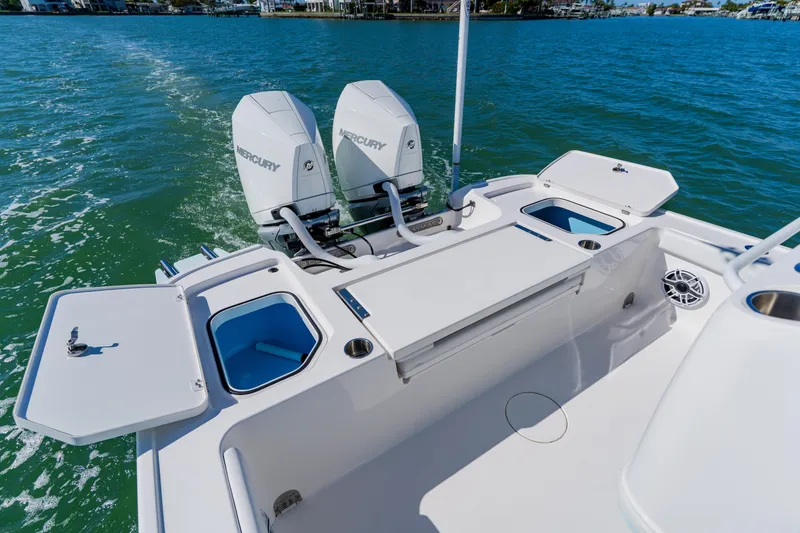 Slide: The Image of 2022 Caymas 28 HB boat with dual Mercury engines on open water. - 35