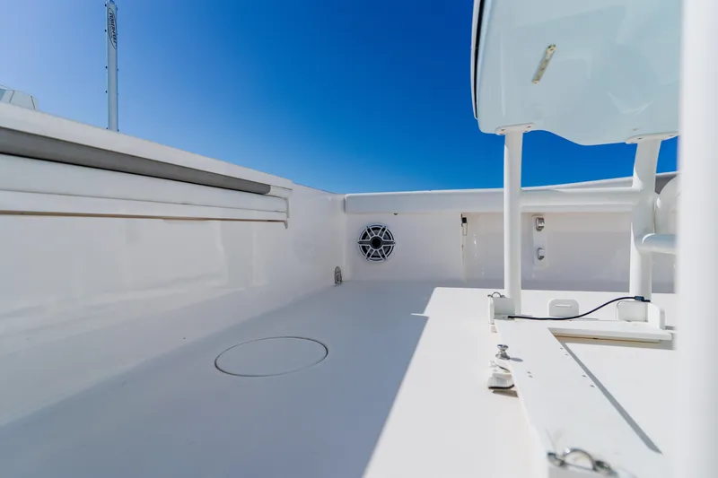 Slide: The Image of 2022 Caymas 28 HB boat deck with clear blue sky background. - 40