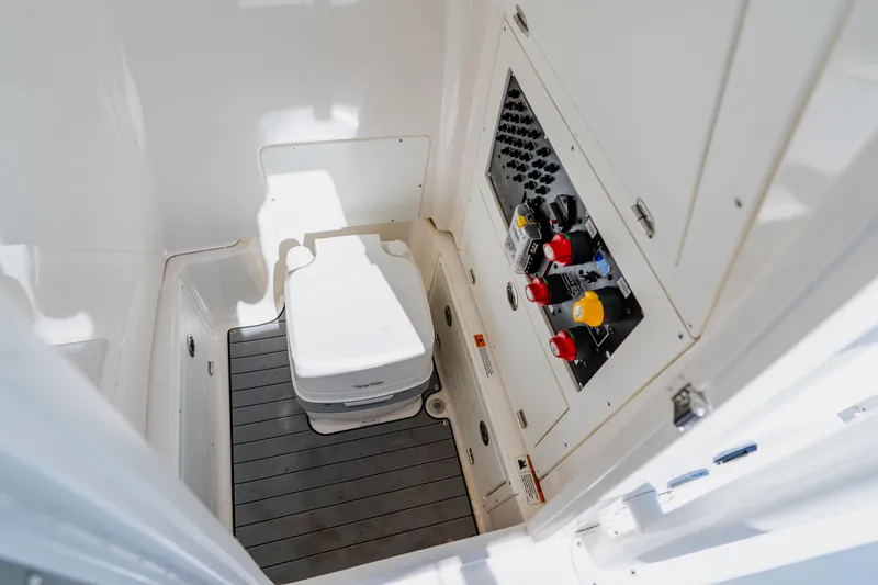 Slide: The Image of 2022 Caymas 28 HB boat interior with toilet and control panel. - 42