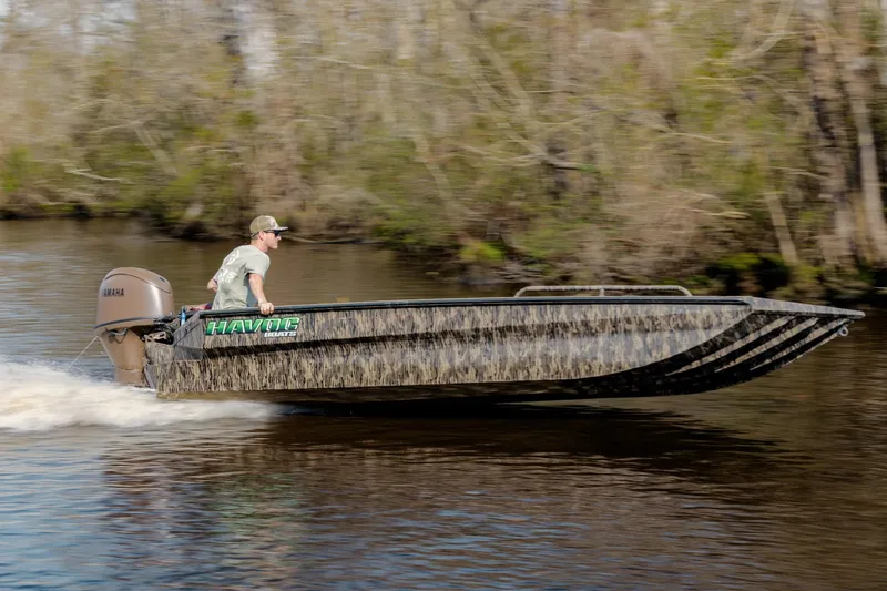 The Image of 2026 Havoc 1756 DBST boat speeding on a river with a Yamaha motor. - 0