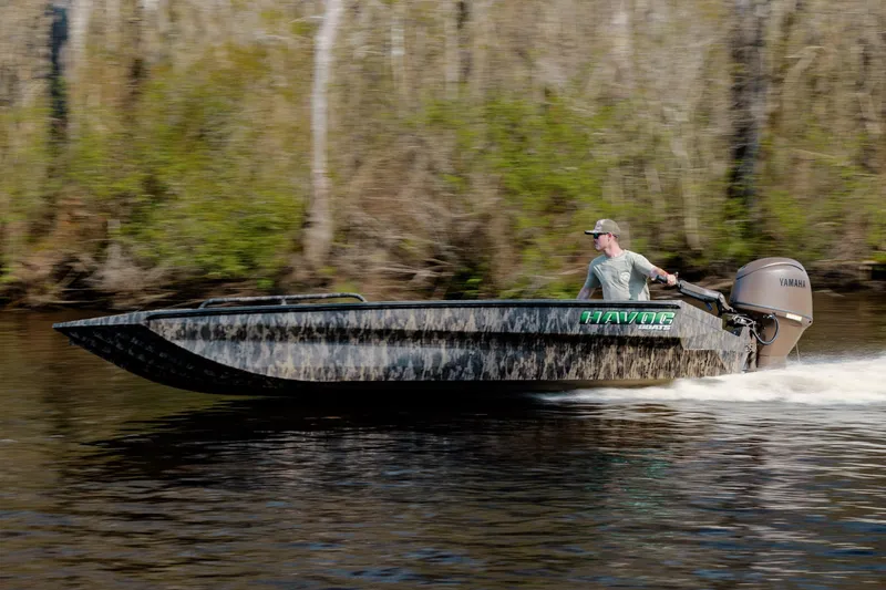 Slide: The Image of 2026 Havoc 1756 DBST boat speeding on a river with a Yamaha engine. - 6