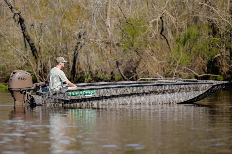 Slide: The Image of 2026 Havoc 1756 DBST boat with Yamaha motor on a calm river. - 9