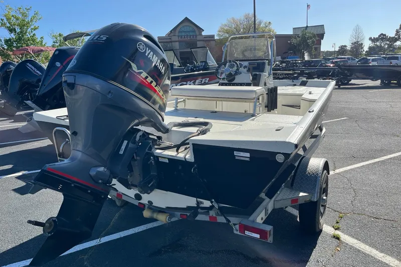 Slide: The Image of 2018 Ranger RB190 Bay boat with Yamaha outboard motor in a parking lot. - 4