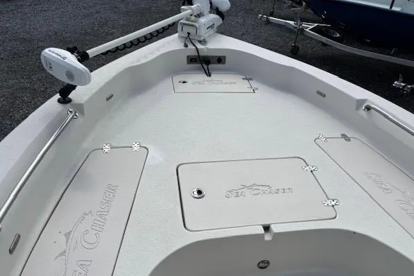 Slide: The Image of 2020 Sea Chaser 23 LX boat deck with storage compartments and trolling motor. - 10