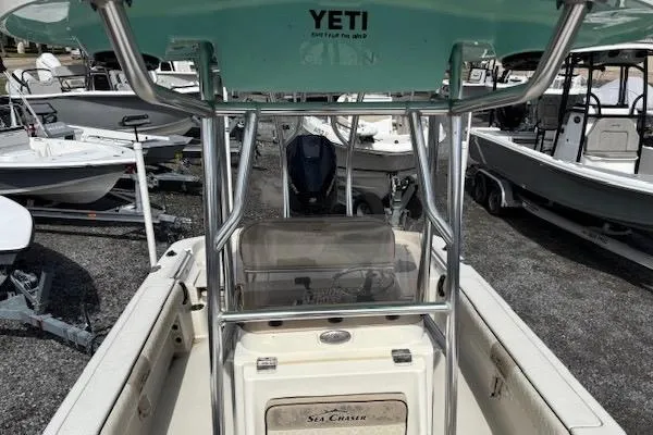Slide: The Image of 2020 Sea Chaser 23 LX boat interior with Yeti cooler, surrounded by other boats. - 11