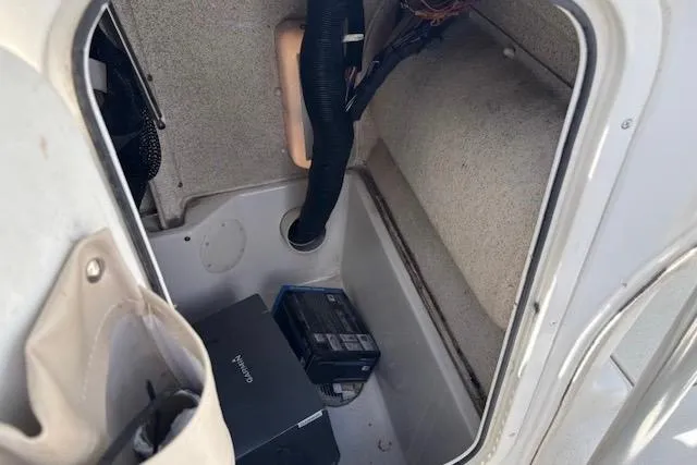 Slide: The Image of Interior storage compartment of a 2020 Sea Chaser 23 LX boat with equipment. - 12