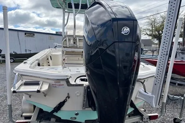 Slide: The Image of 2020 Sea Chaser 23 LX boat with powerful outboard motor, parked outdoors. - 4