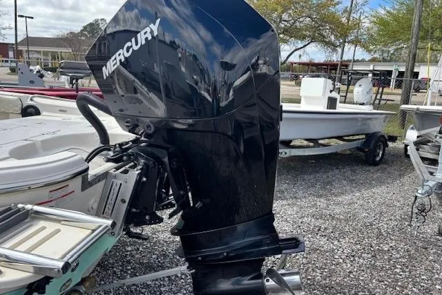 Slide: The Image of 2020 Sea Chaser 23 LX with Mercury outboard motor in a boatyard setting. - 5