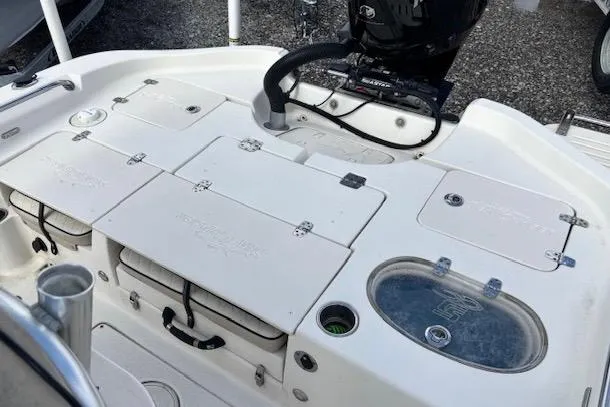 Slide: The Image of 2020 Sea Chaser 23 LX boat deck with storage compartments and motor. - 9