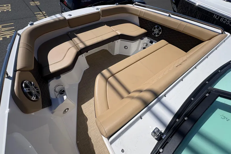 Slide: The Image of 2024 Sea Ray SDX 250 Outboard boat with tan seating and speaker system. - 9