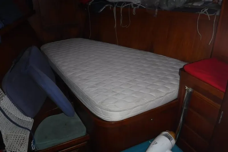 Slide: The Image of Interior cabin of 1987 Cheoy Lee Pedrick 47 yacht with mattress and wooden furnishings. - 11