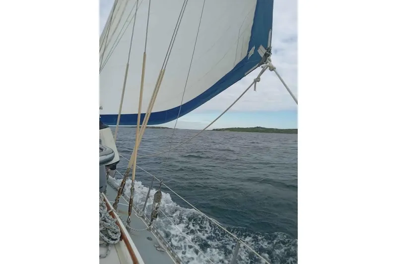 Slide: The Image of Sailing on a 1987 Cheoy Lee Pedrick 47 yacht, ocean view with sails unfurled. - 17