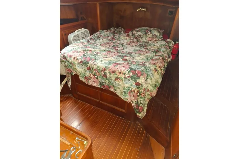 Slide: The Image of Cozy cabin interior of 1987 Cheoy Lee Pedrick 47 with floral bedspread. - 9