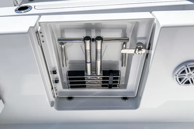 Slide: The Image of 2026 Wellcraft 28 T-Top boat ladder compartment with stainless steel hardware and speaker. - 12