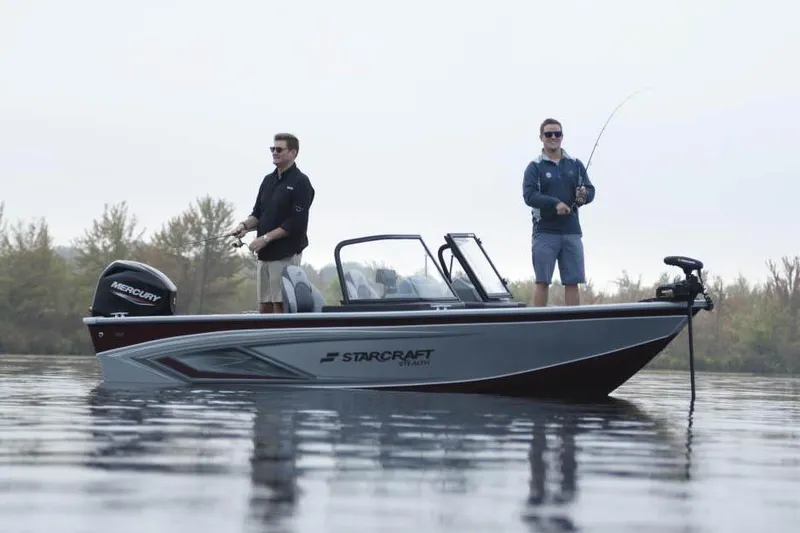 Slide: The Image of Manufacturer Provided Image: 2023 Starcraft Stealth 166 DC boat with two people fishing on a calm lake. - 11