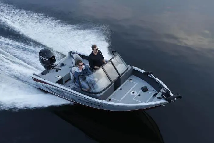 Slide: The Image of Manufacturer Provided Image: 2023 Starcraft Stealth 166 DC boat cruising on water with two passengers. - 13