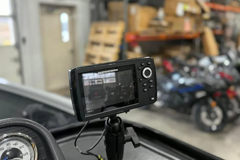 Slide: The Image of Humminbird Helix 5 fish finder on 2023 Starcraft Stealth 166 DC boat dashboard. - 6