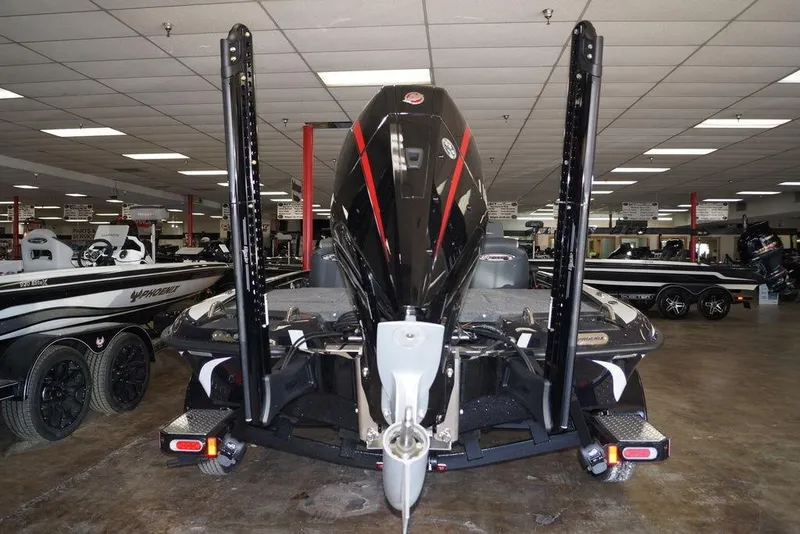 Slide: The Image of 2026 Phoenix 721 ZXL boat displayed indoors, showcasing rear view and motor. - 10