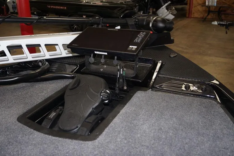 Slide: The Image of 2026 Phoenix 721 ZXL boat dashboard with advanced navigation controls and display screen. - 18