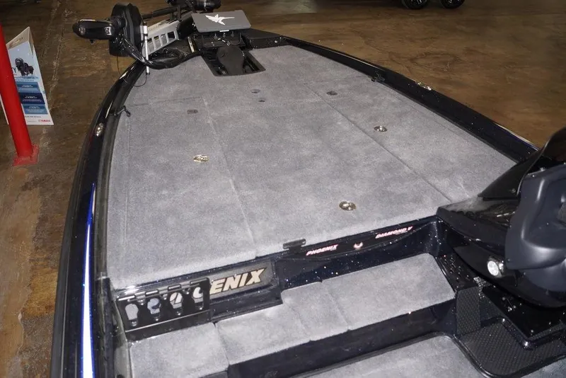 Slide: The Image of 2026 Phoenix 721 ZXL boat interior with gray carpeted deck and advanced equipment. - 19