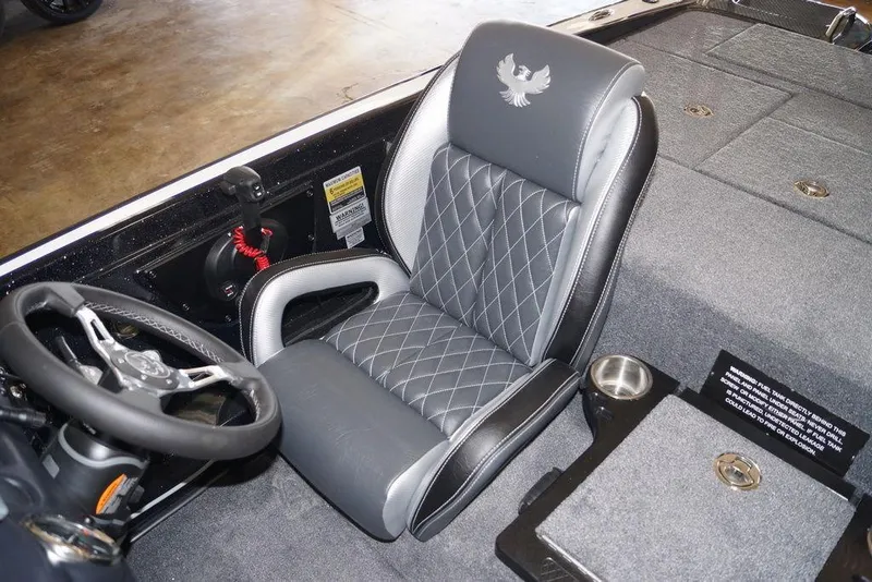 Slide: The Image of 2026 Phoenix 721 ZXL boat interior with steering wheel and cushioned seat. - 23
