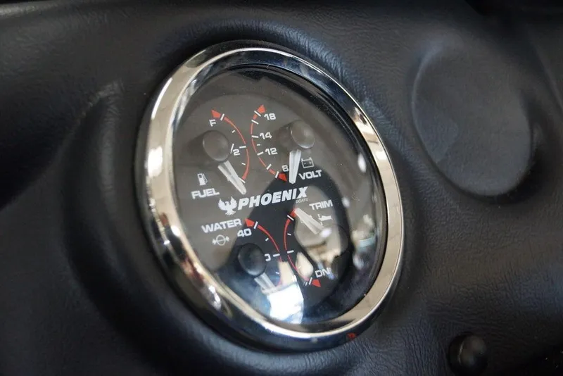 Slide: The Image of Dashboard gauge of 2026 Phoenix 721 ZXL boat, showing fuel, volt, and trim levels. - 25