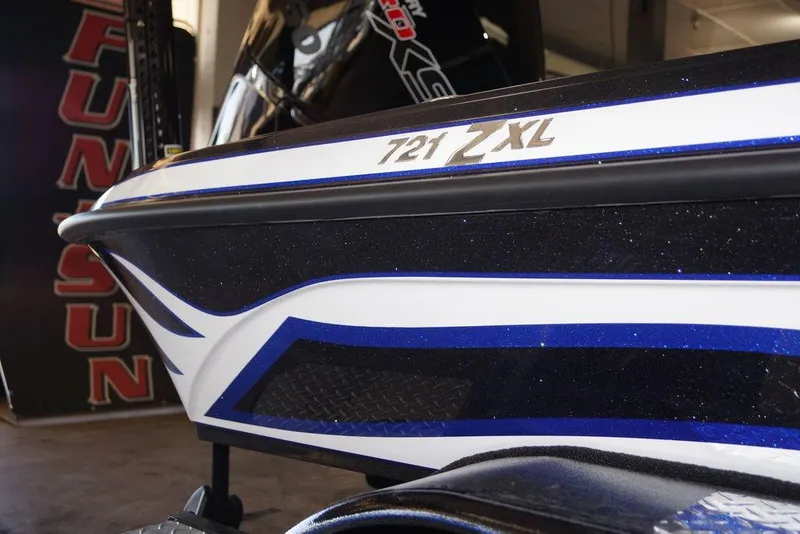 Slide: The Image of Close-up of 2026 Phoenix 721 ZXL boat with sleek blue and white design. - 4