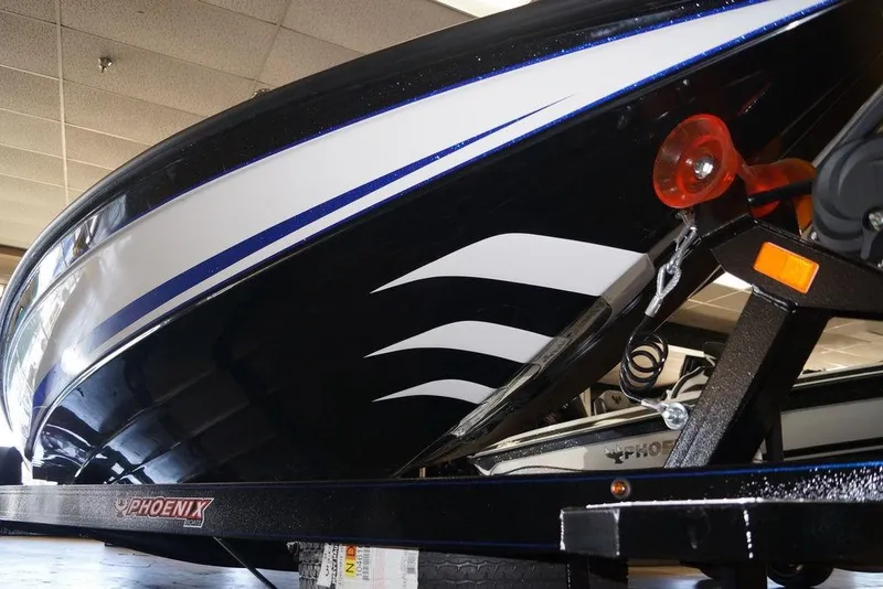 Slide: The Image of 2026 Phoenix 721 ZXL boat on trailer, showcasing sleek design and vibrant colors. - 9