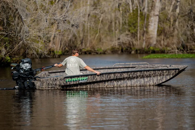 Slide: The Image of Man operating 2026 Havoc 1756 MSTC boat on a calm river. - 11