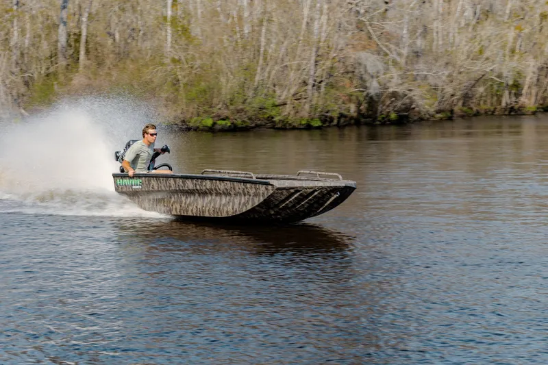 Slide: The Image of Man driving 2026 Havoc 1756 MSTC boat at high speed on a river. - 5